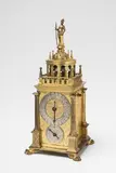 A table clock by Hans Gruber of Nuremberg by A table clock by Hans Gruber of Nuremberg, Engraved and fire-gilt brass with engraved and blackened silver, glass, iron hands, iron cogs. Day-running with hourly s, offered Nov 2017