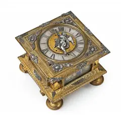 David Weber, An Augsburg single-hand table clock, Engraved and gilt bronze with parcel gilt silver dial and appliques, glass, brass, steel, silver-plated bronze bell to the base. Day-running with hourly striking. Horizontal clock in a cuboid case with glazed openings to the facets, resting on on high turned feet. The mobile hand supported by the figure of an angel applied to the central gilt alarm aperture. With flowerhead caps to the angles and engraved floral decor to the edge of the plate. Engraved to the plate: David Weber Augusta (?). Minimal losses to the appliques