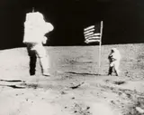 Nasa, Apollo 16 TV Picture - Astronaut John W. Young leaps from the lunar surface as he salutes the U.S. flag