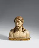 Probably Florence, mid-15th century, A presumably Florentine carved wooden figure of Christ as the Man of Sorrows, mid-15th century, Carved in the round, with older polychromy. This bust depicts Christ nude with His head leant to the side and His lips slightly parted, in a manner corresponding to that of contemporary depictions of the Man of Sorrows. This finely carved, expressive, and life-like piece is thought to originate from the circle of Desiderio da Settignano (ca. 1430 Settignano - 1464 Florence). Mounted on a presumably original plinth, painted to resemble marble. Wear with minor losses