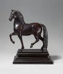 A bronze figure of a pacing stallion by called Giambologna Giovanni di Bologna, Hollow cast bronze on an ebonised wood plinth. Bronze H, sold May 2017