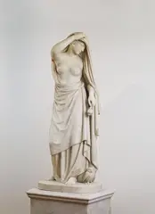 Emil Wolff, "Die Nacht", White Carrara marble. An important, almost life-sized sculpture of a female allegory. She is depicted striding and drawing a starry veil over her head. Her hair is decorated with a garland of poppy flowers and she holds two poppy seed capsules in her hand. A small owl perches at her feet. Signed to the right edge of the base: AEM.WOLFF ROMAE FECIT. The bird's beak slightly defective. H of sculpture ca. 152, W ca. 68, D ca
