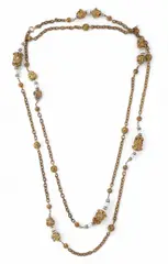 A Robert Goossens sautoir for Chanel, 1960s, A Robert Goossens sautoir for Chanel, 1960s, Bronze toned and gold plated metal, rhinestones, artificial pearls. Unsigned. Wire partially bent. L