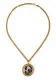 A Chanel medallion de Coco collier, 1985, A Chanel medallion de Coco collier, 1985, Gold plated metal, print after a photograph. The medallion signed: Chanel. Minor dents