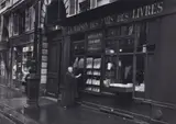 Gisèle Freund, Adrienne Monnier in front of her bookstore, Rue de L'Odéon, Paris