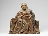 Südtirol ca. 1510, A South Tyrolean carved Swiss pine wood high-relief group of Anna Selbdritt, circa 1510., With older, possibly original, polychromy. St. Anne is shown seated on a broad, block-like bench facing the beholder. She wears a white veil and a simple, floor-length gown. The dark red cloak worn over her left shoulder lies draped across her body and drawn over her knees where it falls in a rich interplay of thick vertical and compressed folds. The Virgin stands next to Her mother, and St. Anne embraces Her with her left arm whilst Mary in turn reaches out towards the Christ Child who is shown seated on His Grandmother’s lap. The drapery of the Virgin’s gown corresponds closely to that of St. Anne’s cloak, lending a harmonic impression to the entire composition. Both the overall design and details of this work, such as the facial features, display direct parallels to another Anna Selbdritt group from South Tyrol (possibly Meran) made in around 1510 - a work closely related to those of the painting and sculpture workshop of Hans Schnatterpeck in Meran and of Matheis Stöberl in Sterzing. Both hands and one arm of the Child missing. Crack in the shoulder of the figure of Saint Anne. Wear to the plint