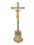 Johann Gottlob Jäncke, A large Liegnitz silver crucifix, Worked in partially gilt silver, iron and bronze on a wooden corpus, with régence decor. Engraved to the back of the base with the dedication: "Herr Adam Germanisius, vornehmer, klüger wie auch kö. preus. privileg: Apothecker gaf Gott zu Ehren der Kirchen zu ... (illegible) dieses Crucifix. Verehret 1755 d. 12, Deceber." H
