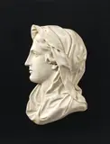 France circa 1800, A French marble depiction of the Virgin in profile, circa 1800., White carrara marble, the reverse flattened. This depiction of the Virgin in stark profile facing left would originally have been accompanied by a pendant image of Christ. The work follows the Neoclassical forms of the bronze relief of 1691 in the tabernacle of the church of Saint-Jean in Troyes created by the court sculptor to Louis XIV of France, François Girardon (1628-1715). With minimal wear. Set into a modern slate panel