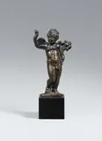 Venice first half 17th century, A Venetian bronze figure of a putto with a cornucopia, first half 17th century., Cast in the round, engraved and with old patina.. A figure of a winged putto holding a cornucopia and fruit, standing in pronounced contrapposto with his right foot resting on a fish. On a triangular base. Minimal wear, the patina slightly rubbed. Mounted on a marble plinth
