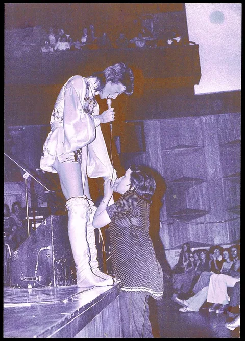 Mick Rock, DAVID BOWIE WITH FAN, OXFORD TOWN HALL, 1972, photograph
