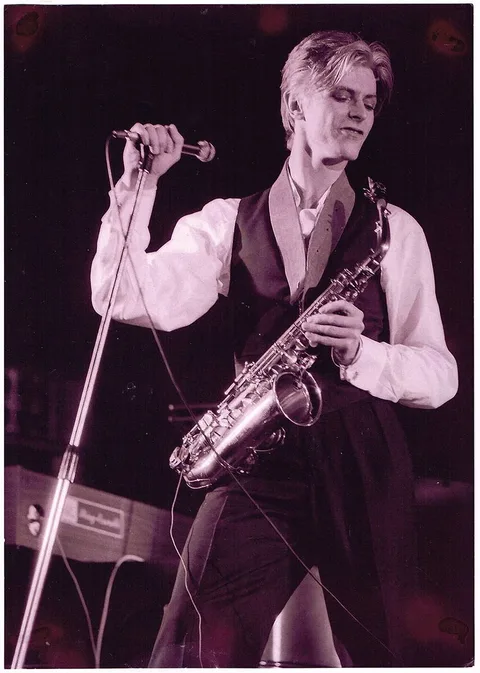 Mick Rock, DAVID BOWIE WITH SAXOPHONE, 1972, photograph