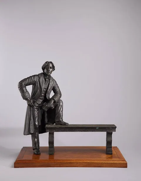 OSCAR WILDE by Jeanne Rynhart, 1989, resin on wooden base, sold Oct 2023