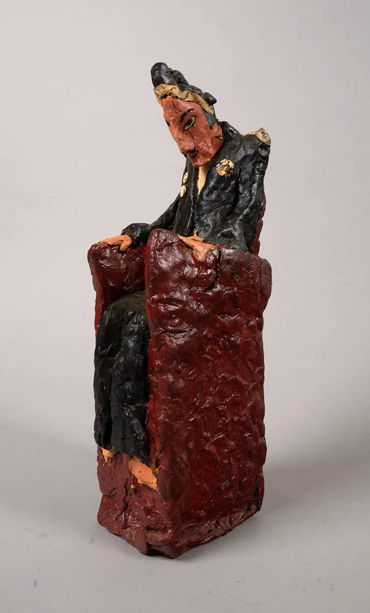 MAN SEATED by Graham Knuttel, painted papier-mâché, offered Dec 2021
