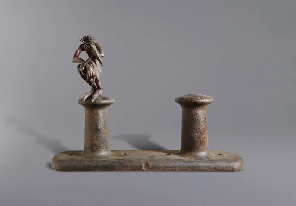 MAN SITTING ON CLEAT by Patrick O'Reilly, bronze on cast iron, offered Nov 2018