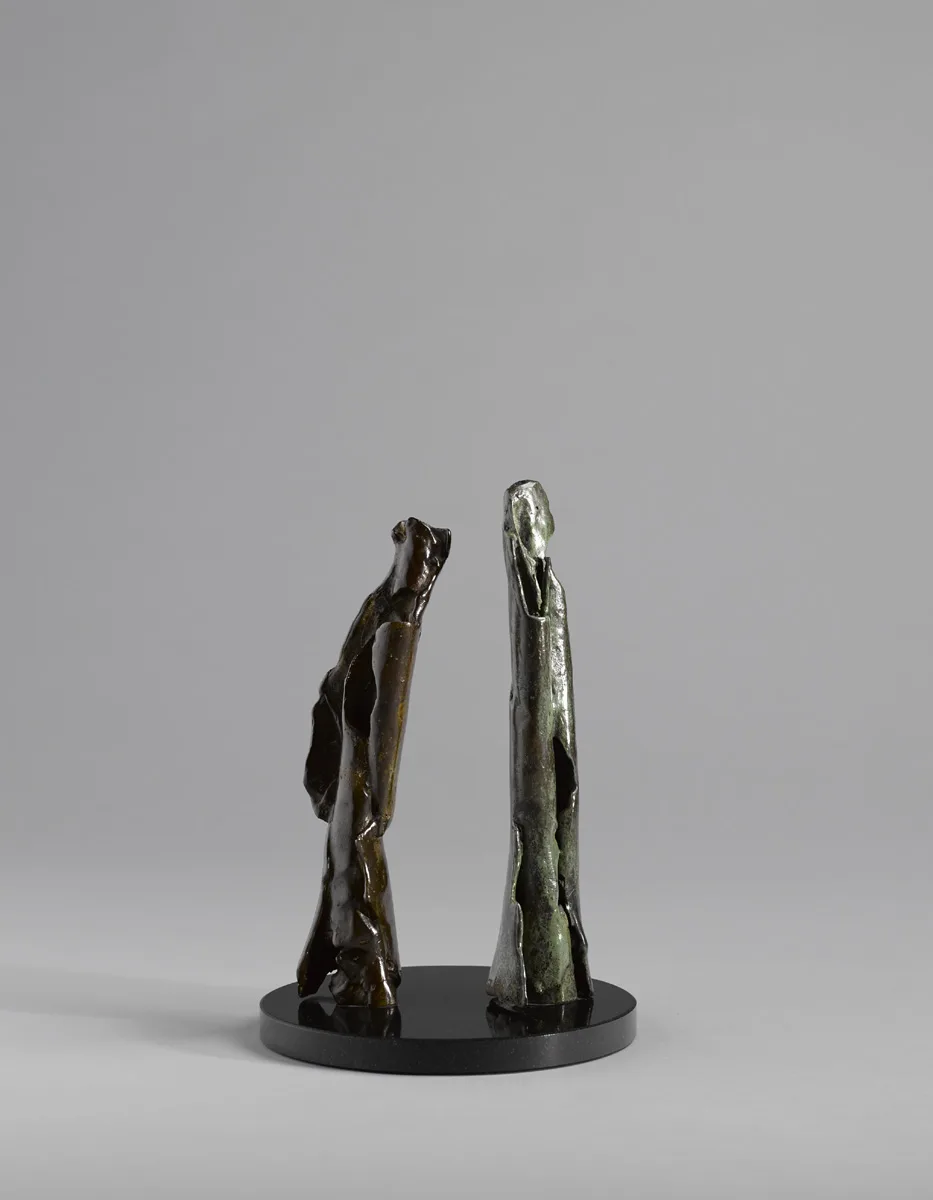 TWO FIGURES by Joseph Sloan, 2000, bronze on black marble base; (unique), offered May 2016