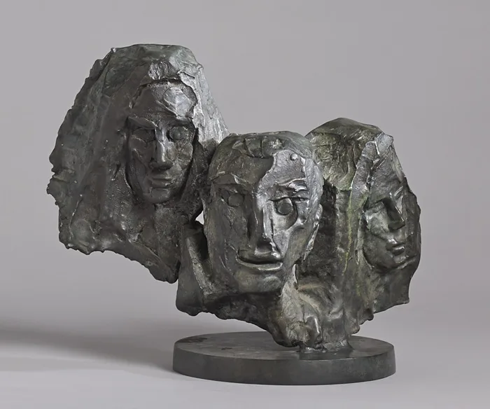 John Behan, THE EMIGRANTS, bronze on circular stone base; (unique)