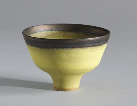 Dame Lucie Rie, FOOTED BOWL, c.1980, yellow glazed porcelain with manganese rim