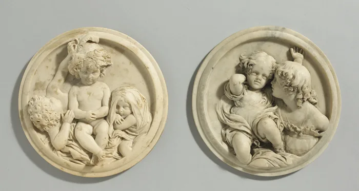 PAIR OF ROUNDELS DEPICTING CHILDREN by Edward William Wyon, alabaster carved in high relief; (2); (tondo, neither plaque mounted), sold Sep 2013