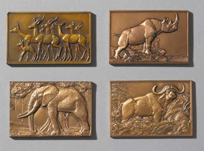 Francois Thenot, ANTELOPE, RHINOCERUS, ELEPHANT and BUFFALO, (SET OF FOUR), bronze bas-relief, three with a copper colured patina (set o