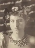 Wilhelm von Gloeden, Young man with a wreath of flowers