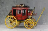 Brian L. Ford, Group of Eight Western Era Wagons, hardwood, steel, and mixed media