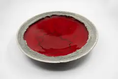 Len Castle, Lava Lake bowl, earthenware with deep red glaze to the interior, matt grey stained sculptured cavetto and black glazed exterior