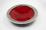 Len Castle, Lava Lake bowl, earthenware with deep red glaze to the interior, matt grey stained sculptured cavetto and black glazed exterior