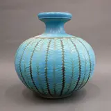 Graeme Storm, Floor vase, stoneware with carved slip repeating floral decoration, matt turquoise glaze with dark brown negative detail