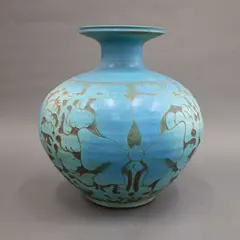 Graeme Storm, Floor vase, stoneware with carved slip floral decoration, matt turquoise glaze with dark brown negative detail