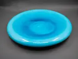 Peter Collis, Rolled edge charger, white earthenware with turquoise glaze to the interior, and matt black stain to the exterior