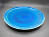 Graeme Storm, Large wall charger, stoneware with rich matt blue barium glaze, fitted with hanging wire