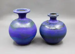 Graeme Storm, Two matching vases, stoneware with dark blue and green barium glaze