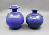 Graeme Storm, Two matching vases, stoneware with dark blue and green barium glaze