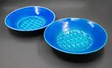 Merilyn Wiseman, Pair of matching bowls, glazed ceramic, with bright turquoise rims and decorated centres, with matching decoration to the bases