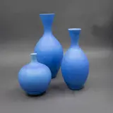 Potter Unknown, Set of three powder blue vases, glazed porcelain