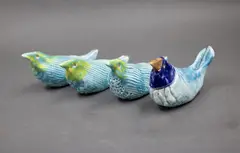 Rosemary Brittain, Four porcelain birds, with blue and green glazes and golden highlights