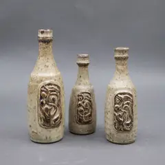Potter Unknown, Three small bottle vases, glazed stoneware with relief decoration