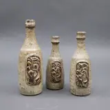 Potter Unknown, Three small bottle vases, glazed stoneware with relief decoration