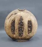 Len Castle, Large Discoid vase, press moulded stoneware washed with yellow ochre pigment and burnt umber, c. 1980's