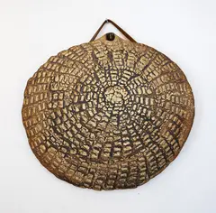 Len Castle, Discoid hanging form, ochre washed stoneware with impressed design