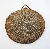 Len Castle, Discoid hanging form, ochre washed stoneware with impressed design
