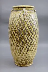 Peter Alger, Large lidded jar, with olive green trickled glaze over a raised basketweave-style reticulated pattern, c. 1990s