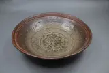 Len Castle, Stoneware bowl, glazed in different shades of brown and with a textured pattern in the centre