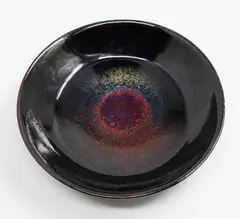 'Sunburst' bowl by Len Castle, stoneware glazed in two stages with a bright red sunburst effect in the cavetto, c. 1980s (tiny old chip, stained by the, sold Sep 2026
