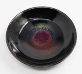Len Castle, 'Sunburst' bowl, stoneware glazed in two stages with a bright red sunburst effect in the cavetto, c. 1980s (tiny old chip, stained by the potter)
