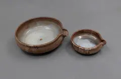 Two lipped pouring bowls by Len Castle, shino glazed stoneware, offered Sep 2026