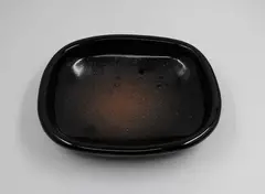 Len Castle, Rectangular dish, stoneware with tenmoku glaze, thinning to a pool of speckled reddish iron glaze to the centre