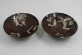 Warren Tippett, Pair of bowls, stoneware, tenmoku glaze with wax resist decoration
