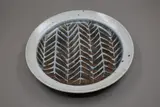 Warren Tippett, Stoneware dish, tenmoku glaze with wax resist decoration