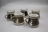 Len Castle, Set of five mugs, stoneware with tenmoku over oatmeal glazes
